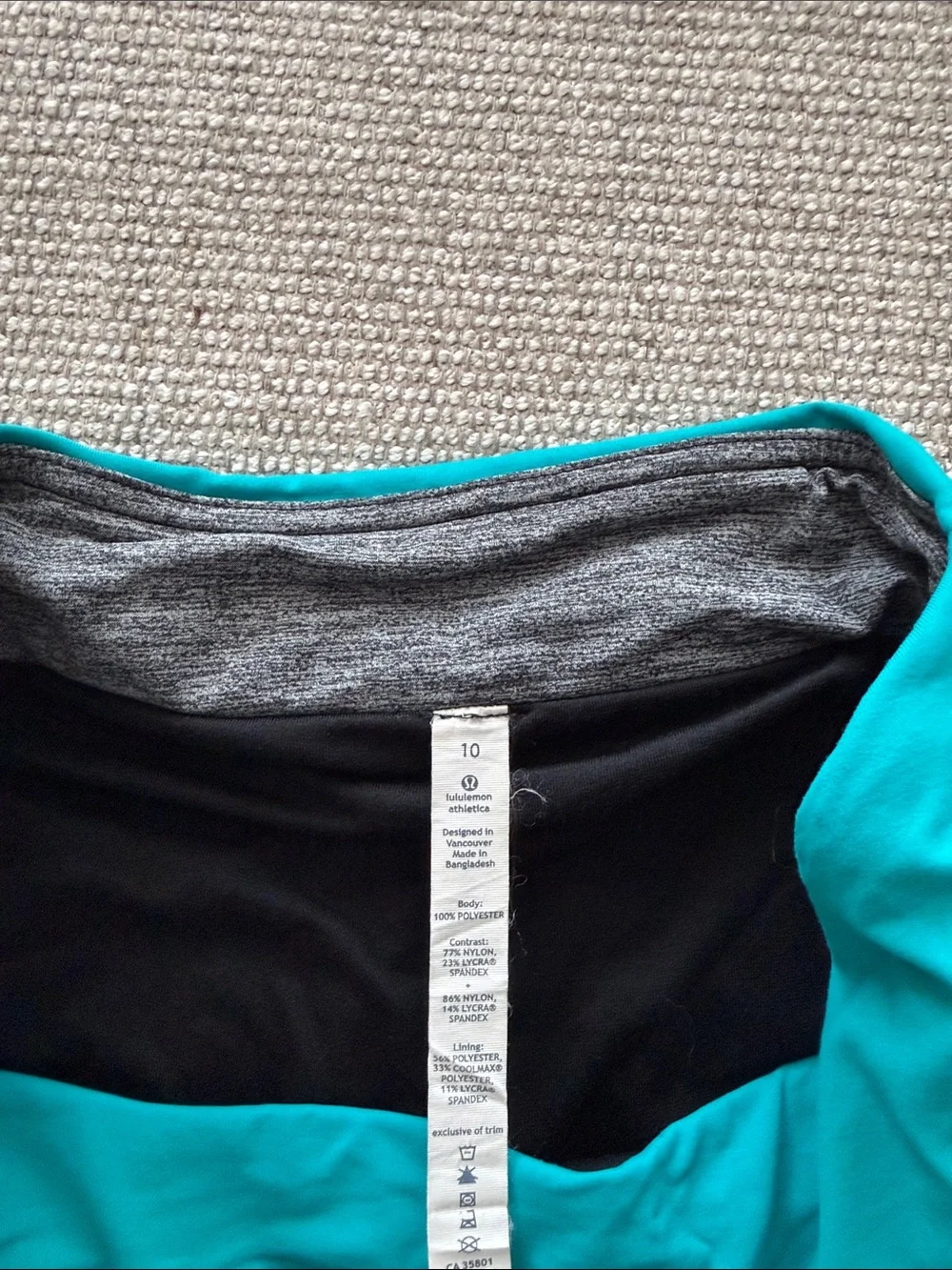 lululemon athletica turquoise pleated skater skirt with black trim